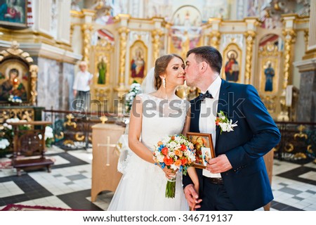 happy wedding couple at church