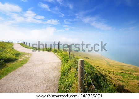 View with a footpath from Cap Blanc Nez on a sunny day with morning fog