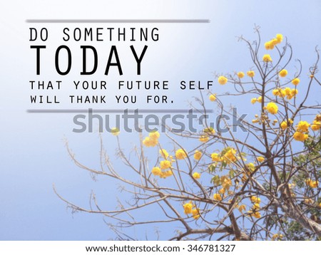 Inspirational quote on blurred flower background.