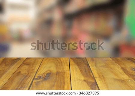 Blurred background of generic supermarket people walking shopping