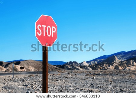 Stop sign in a desolate area 