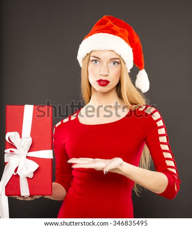 Christmas Santa hat isolated woman portrait hold christmas gift. 