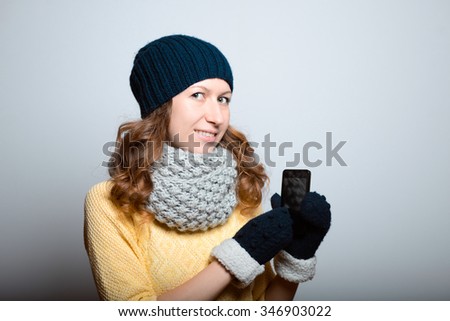 beautiful girl coughs and ill, in a bright yellow color, lifestyle winter clothes studio photo isolated on a gray backgroundter clothes studio photo isolated on a gray background