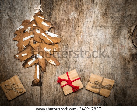 Christmas tree and presents on vintage wooden background with copy space