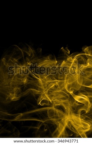 Gold smoke on black background,