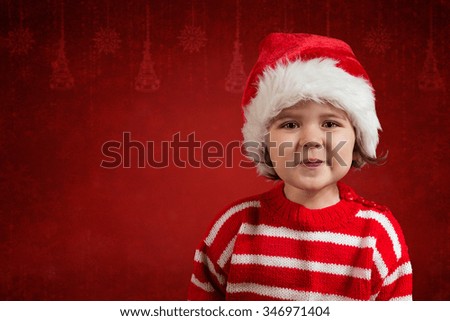 Cute little girl in red santa hat on the red background