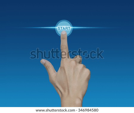 Man hand push start button on touch screen over blue background