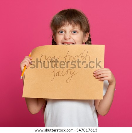 lost tooth girl portrait, studio shoot on pink background