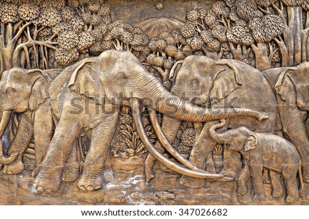 Elephants stone carve wall in the Thai public temple