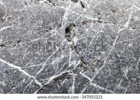 The surface of natural stone as a natural background. Selective focus. Shallow depth of field.