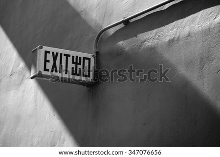 Exit sign in hongkong black and white
