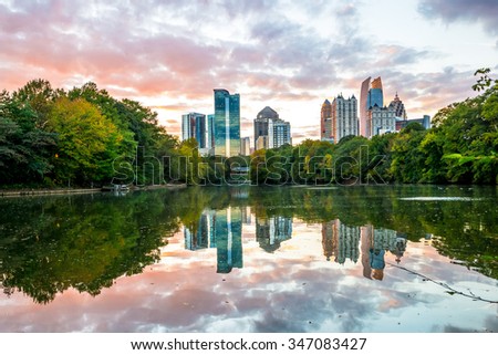Skyline and reflections of midtown Atlanta, in Lake from Piedmont Park, Early Evening sunset