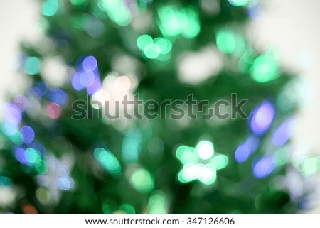 Blurred background of decorated glowing Christmas tree