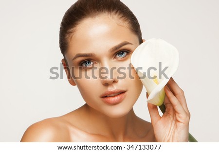 Fresh clear healthy skin on the face of beautiful woman over white background