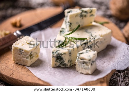 Slice of French Roquefort cheese with walnuts Royalty-Free Stock Photo #347148638