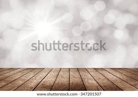 Wood top on white bokeh and light abstract background - can be used for montage or display your products