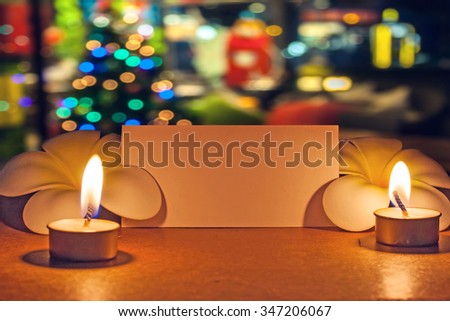 still life candle with flower and note paper,abstract background for pray or meditation caption.