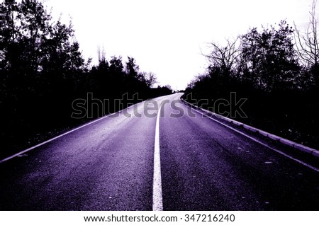 Picture of an empty asphalt purple road. 