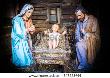 christmas nativity scene represented with statuettes of Mary, Joseph and baby Jesus