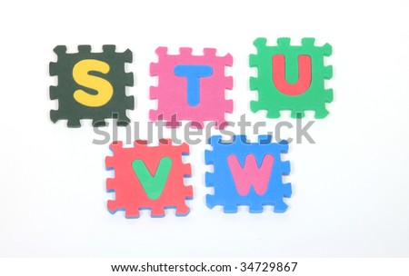 colourful building blocks with alphabets on white