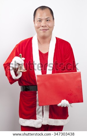 Happy santas holding blank banner with copy space