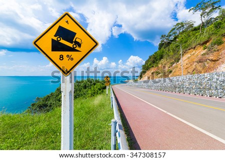 warning steep and slope road sign