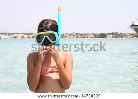 little girl with snorkeling equipment