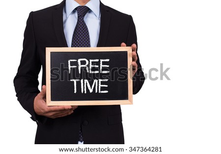 Businessman holding mini blackboard with FREE TIME message