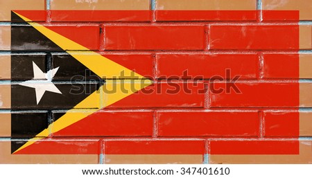 East Timor flag painted on old brick wall texture background