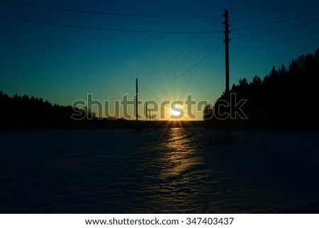 The sun's rays at sunset in winter