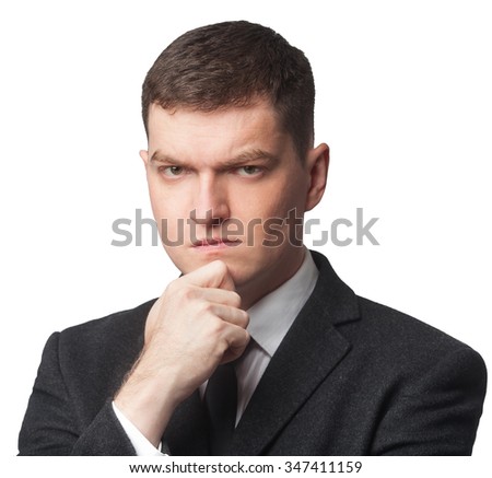 Businessman in suit with hand on chin on white isolated background