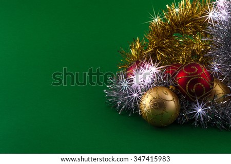Christmas decoration, red gold and silver, on green background