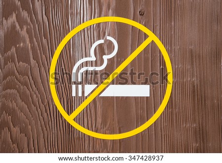 No smoking sign on wood background