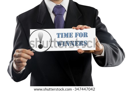 Close up businessman or salesman holding in hands magnifying glass and paper with Time For Winners message isolated on white background