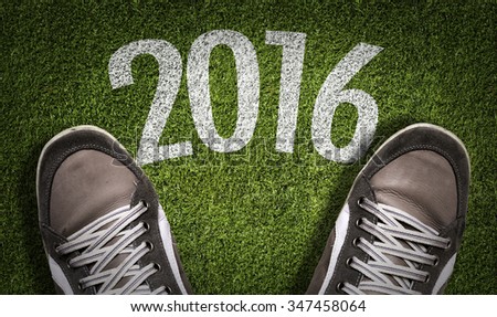Top View of Sneakers on the grass with the text: 2016