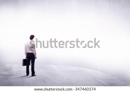 Young sales businessman in elegant suit standing with his back in empty white space background concept