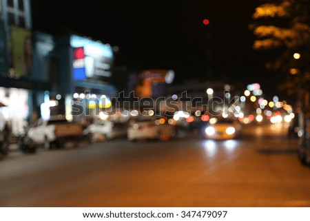 Blurred lights of cars on the road at night.