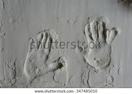 Hand prints of toddler in flour