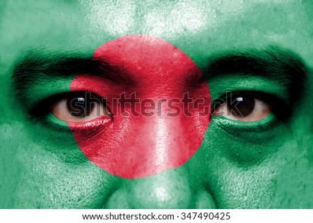 Human face painted with flag of Bangladesh.