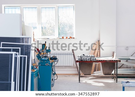 PVC windows and doors manufacturing, factory tools, window frame profile, production equipment Royalty-Free Stock Photo #347552897