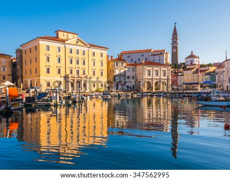 Venetian Port and The Main Square Tartini of Piran City Reflected on Water in Slovenia. Royalty-Free Stock Photo #347562995