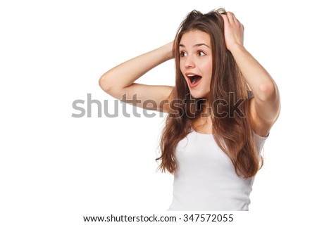 Surprised happy beautiful woman looking sideways in excitement. Isolated on white background