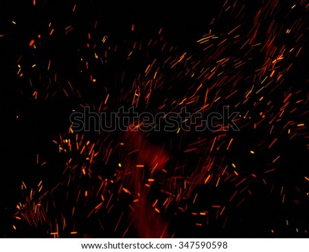 flames of fire with sparks black background