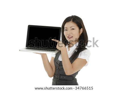 Beautiful Asian businesswoman holding and pointing at a laptop computer