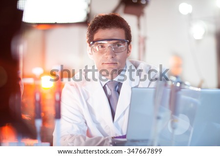 Portrait of a confident male engineer in his working environment. Science and technology concept. Royalty-Free Stock Photo #347667899