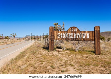 Pioneer town sign on the road