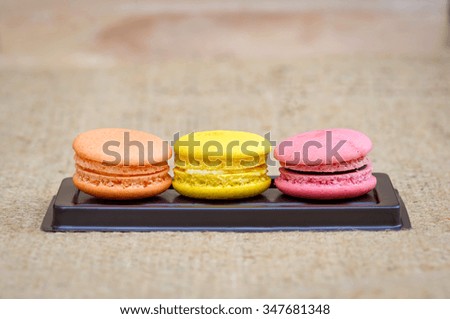 Stack Focus Image Of Colorful French Macarons On Wooden background