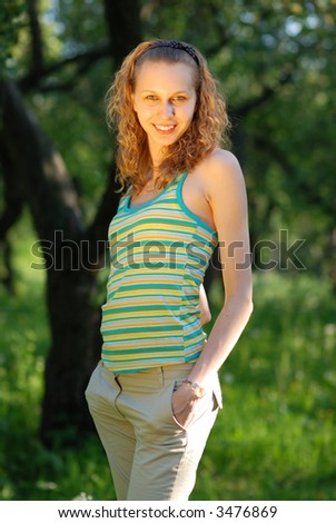 Blond smiling girl in forest