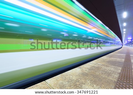 Train in motion at the station, long exposure.