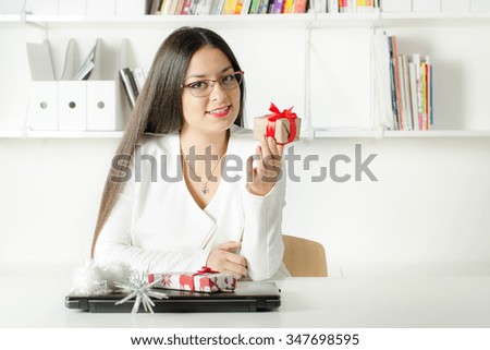 Nice young business girl on her work place